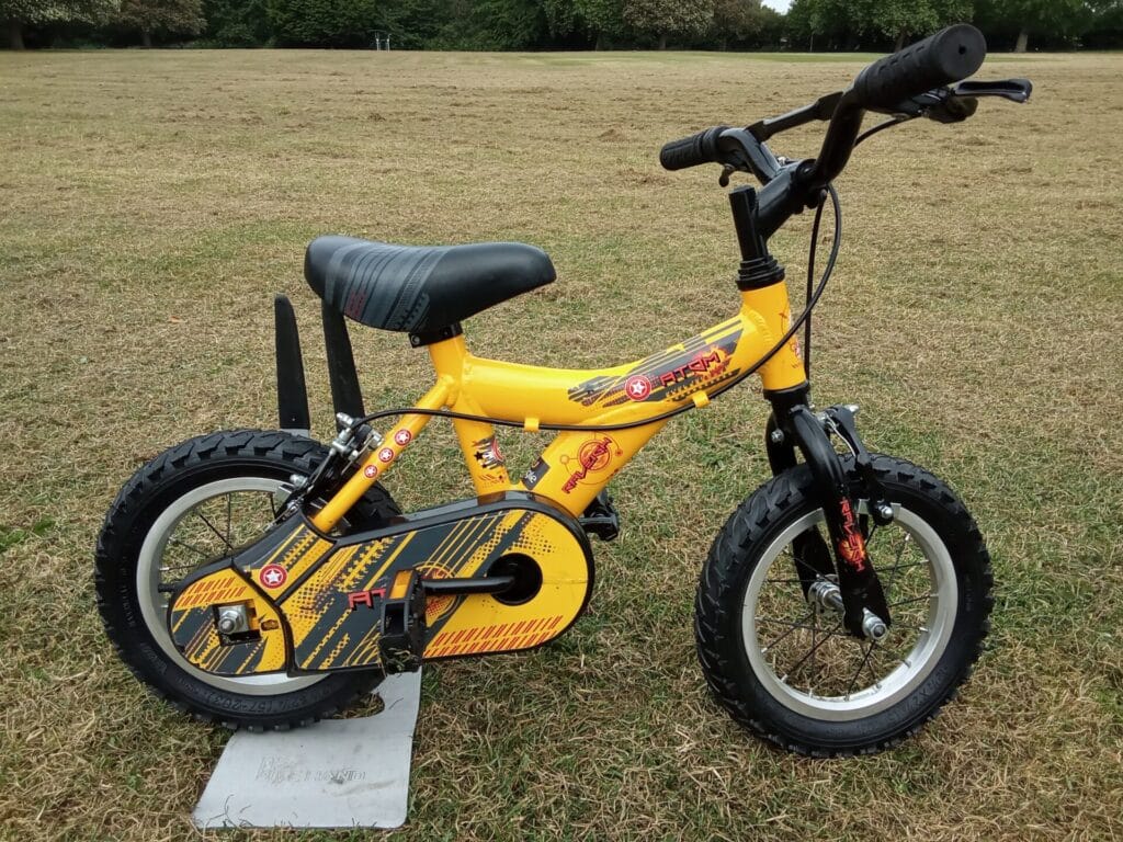 raleigh atom, 12.5 wheel, yellow